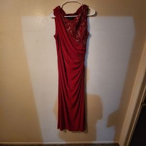 Red floor length slit prom dress.